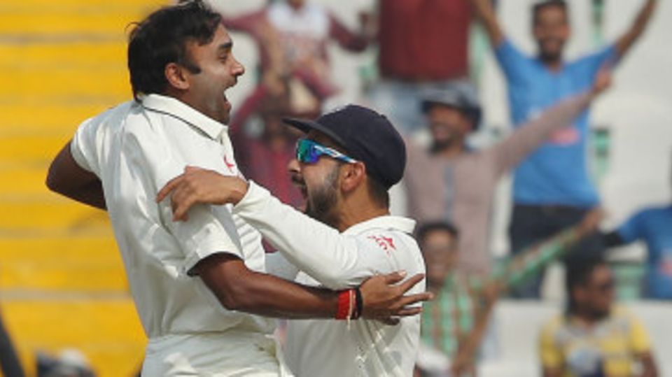 Amit Mishra and Virat Kohli are ecstatic after the wicket of AB de Villiers