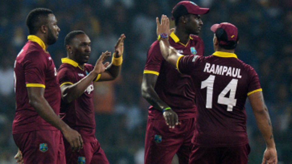 Dwayne Bravo celebrates a wicket with his team-mates