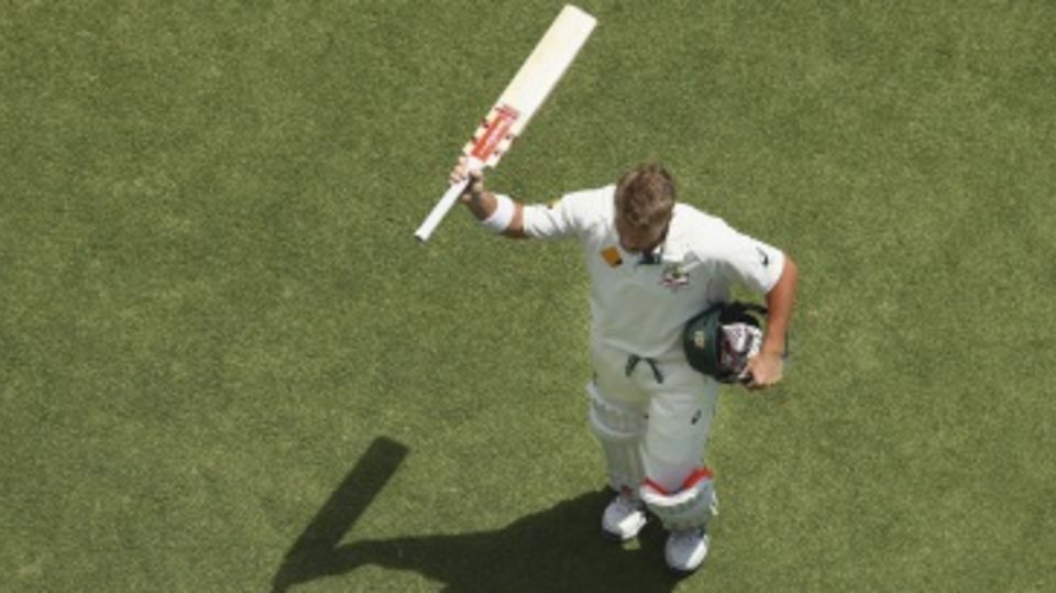 David Warner takes in the applause as he walks back