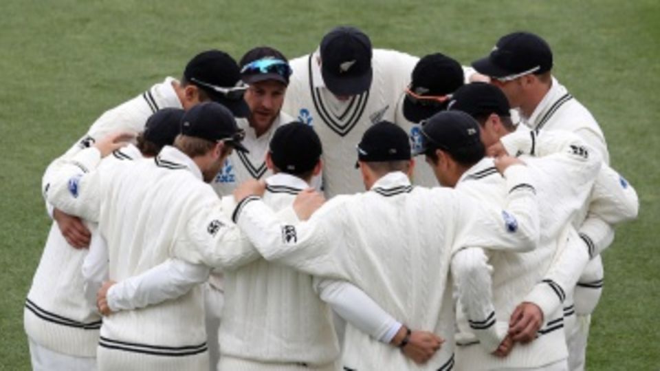 Brendon McCullum talks to his players in a huddle