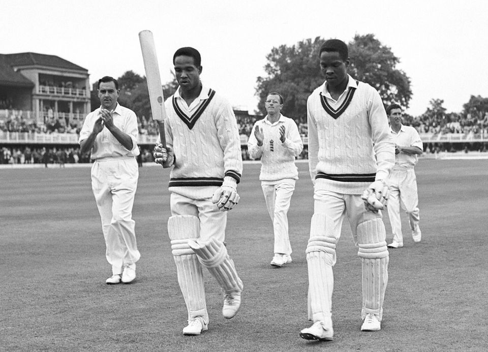 The man of the 1966 season and David Holford leave the field on day four
