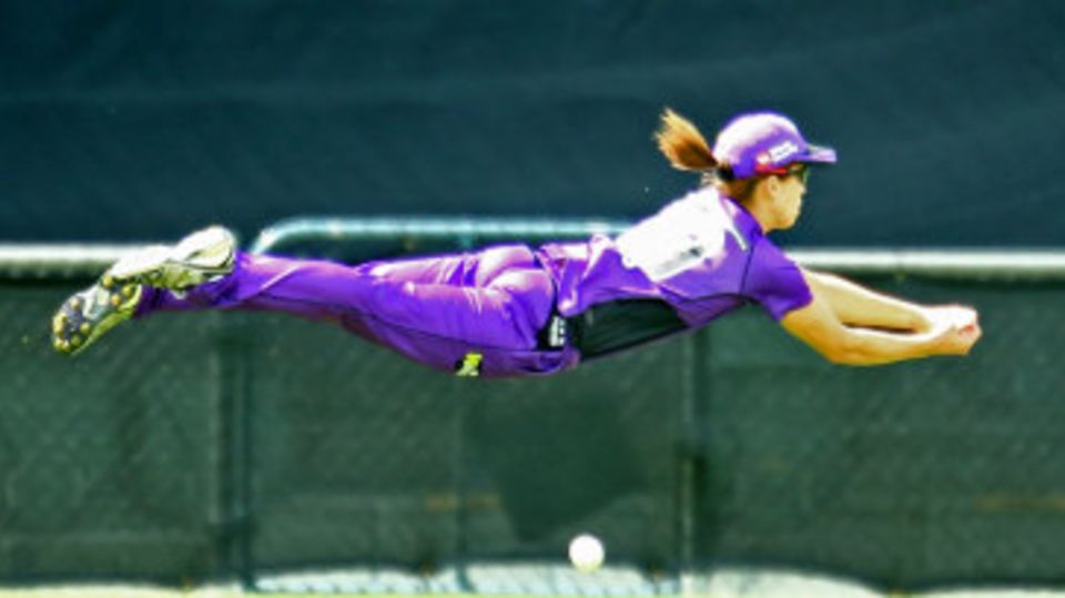 Erin Burns attempts a catch on the boundary