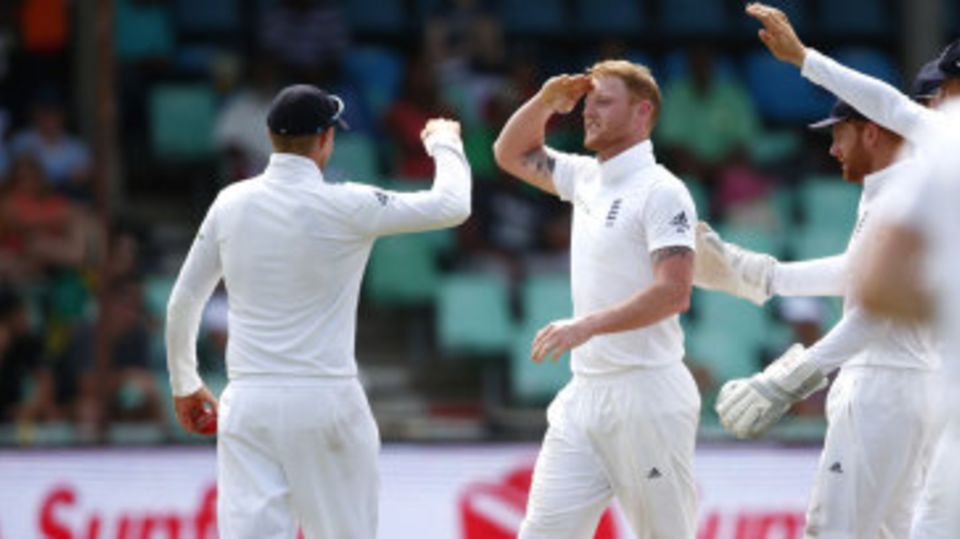 Ben Stokes and Joe Root exchange a salute
