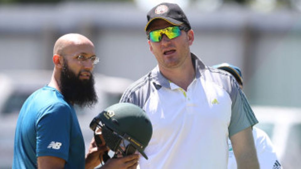 Graeme Smith chats with Hashim Amla during a net session