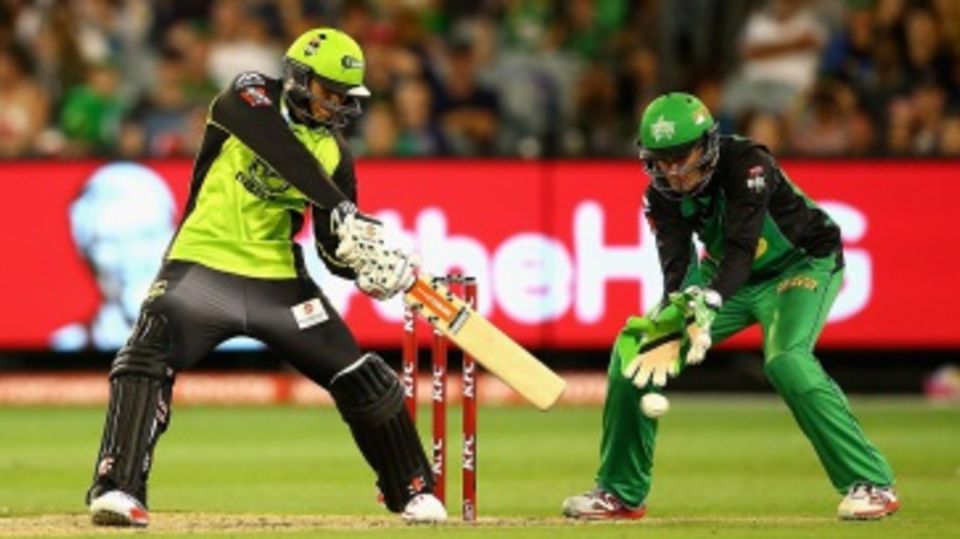 Usman Khawaja rocks back to play a cut