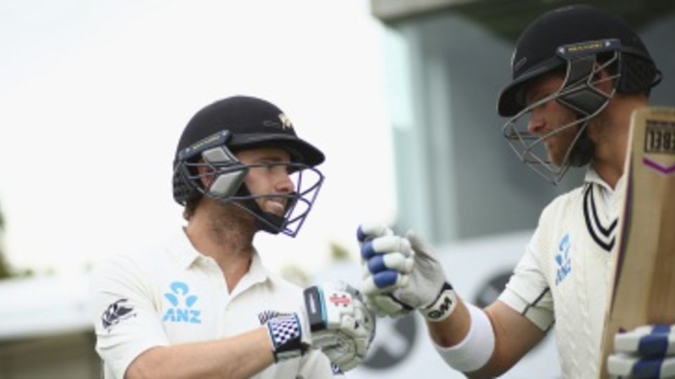 Kane Williamson and Corey Anderson touch gloves before walking out to bat