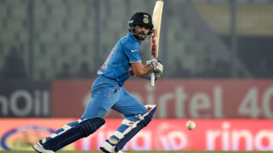 Virat Kohli looks on after playing the ball on the off side