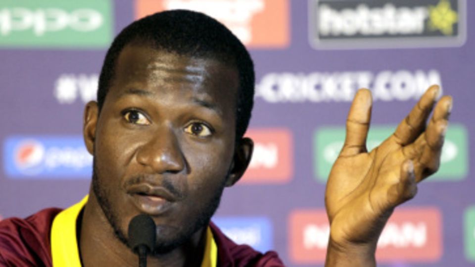 Darren Sammy makes a point at a press conference