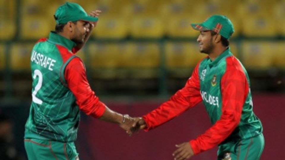Mashrafe Mortaza and Shakib Al Hasan shake hands after winning the match