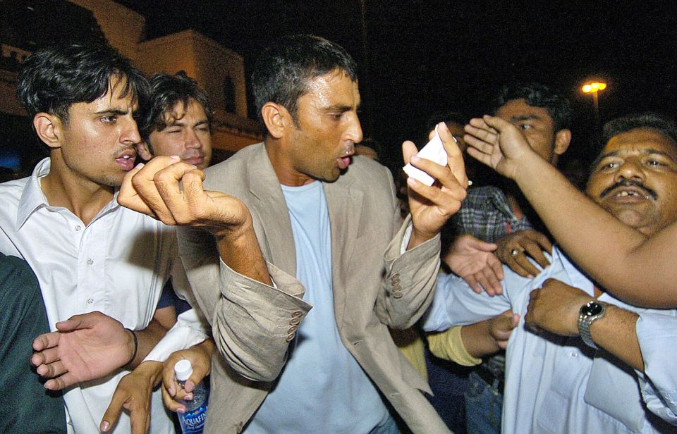 Forever the griping crowd: Younis is mobbed at Karachi airport after Pakistan's early exit from the 2007 World Cup