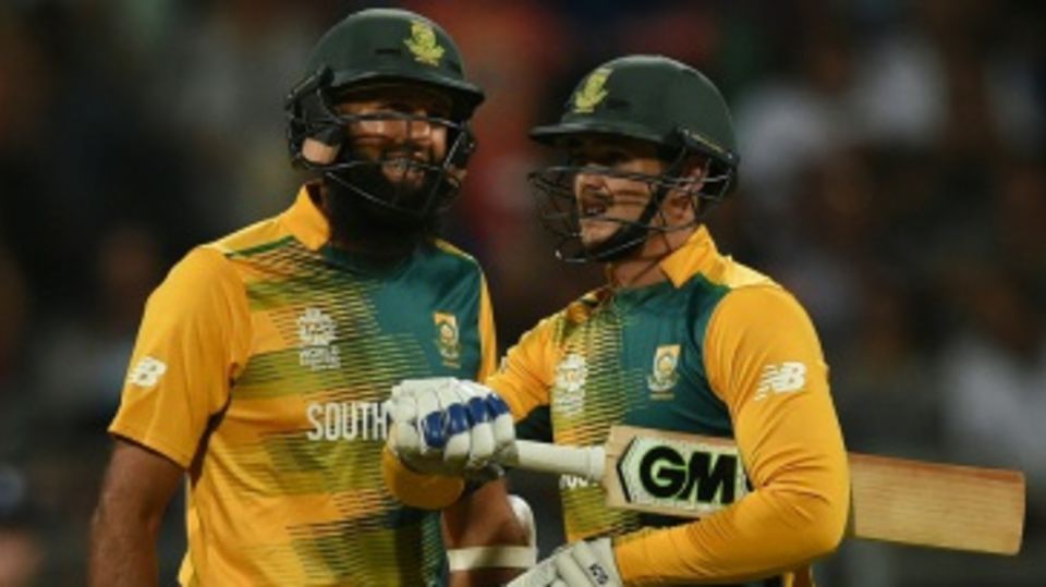 Quinton de Kock and Hashim Amla chat during their opening stand