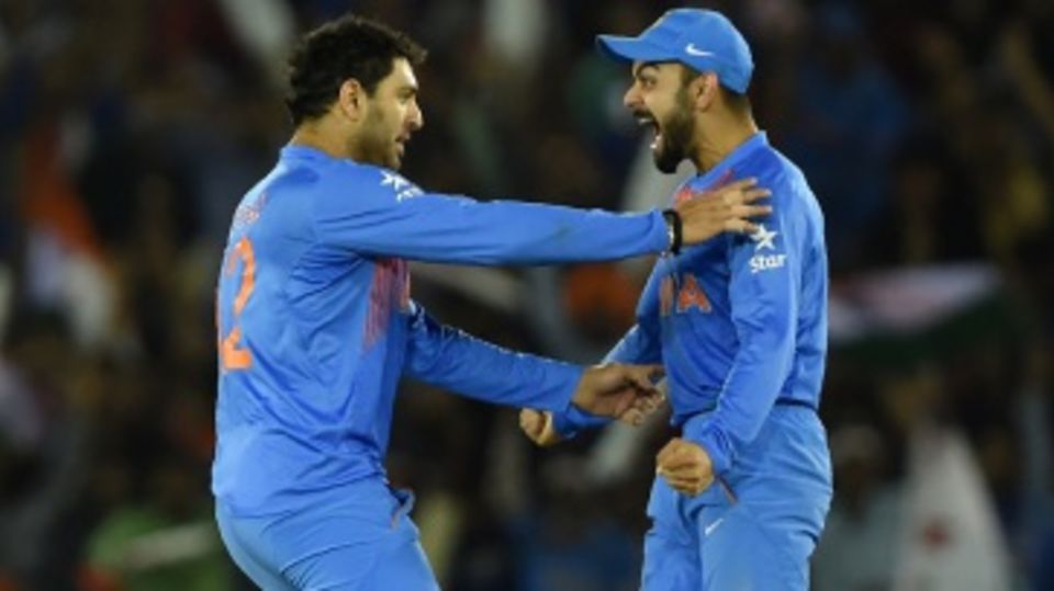Yuvraj Singh and Virat Kohli celebrate Steven Smith's wicket