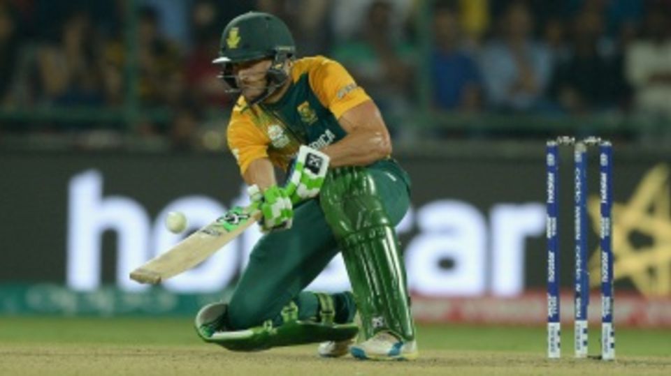 Faf du Plessis sets himself up to play a scoop shot