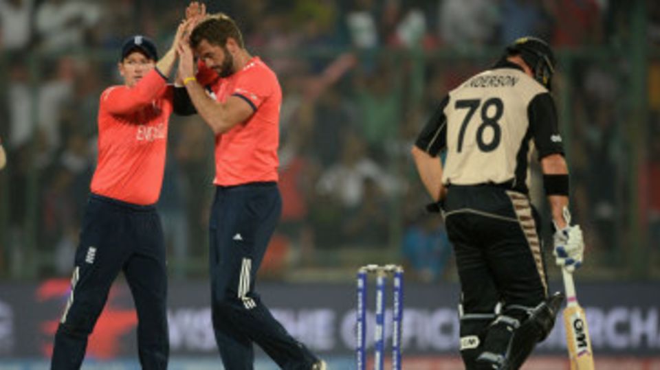 Liam Plunkett is congratulated after picking up Colin Munro
