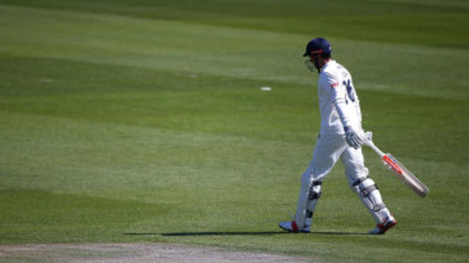 Alastair Cook trudges off after making 1 from five balls in his first innings with his ECB-approved new helmet