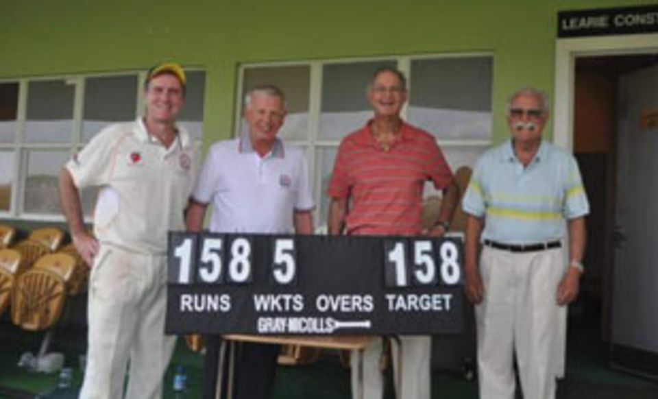 Tony Cozier poses with members of the Craigengower Cricket Club