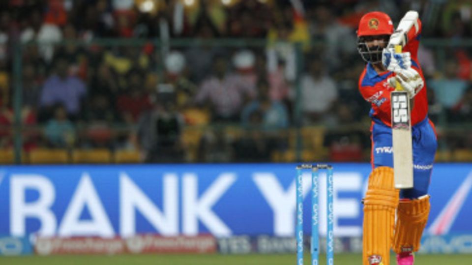 Dinesh Karthik pushes one towards long-off