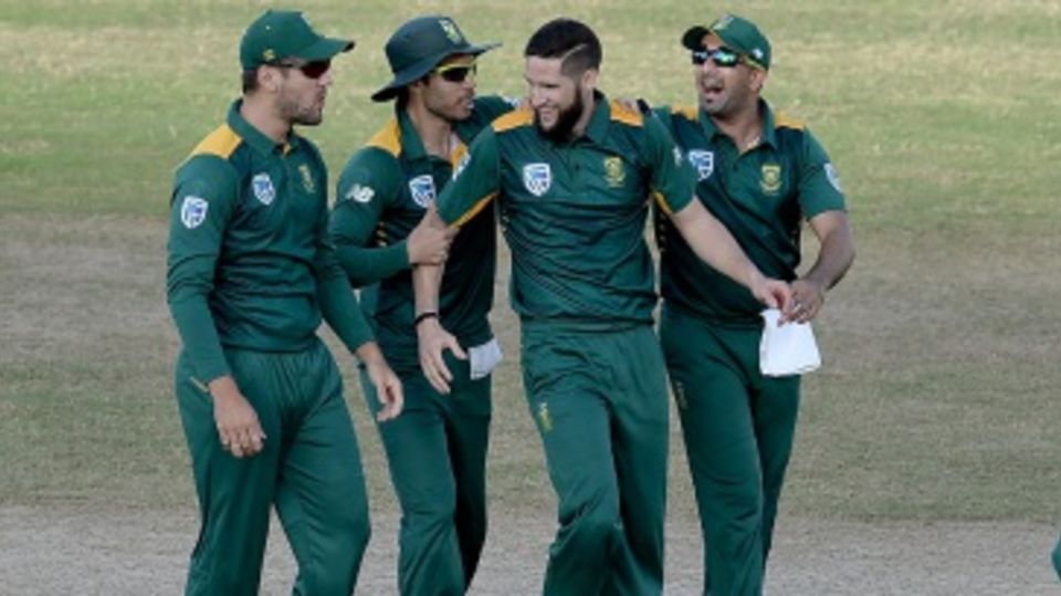 Wayne Parnell is mobbed by his team-mates