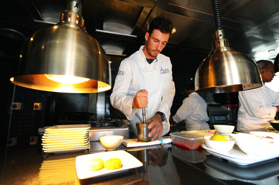Steven Finn preparing food at a Sri Lankan-inspired cooking event