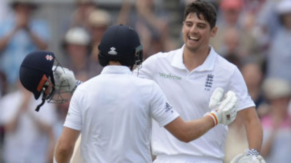Alastair Cook gets a hug from Joe Root after notching a century