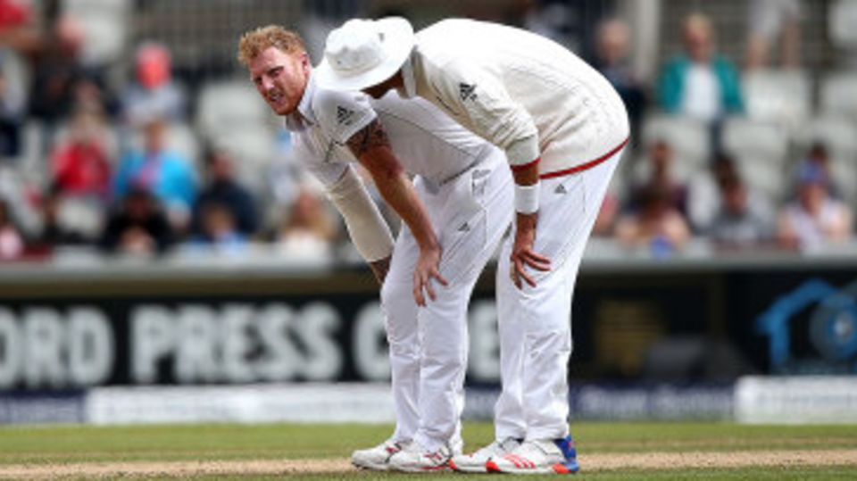 Ben Stokes is consoled by Stuart Broad after pulling up in his followthrough