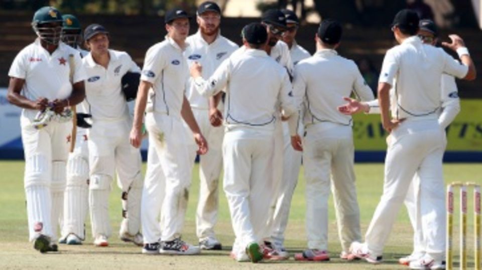 The New Zealand players get together after their innings win