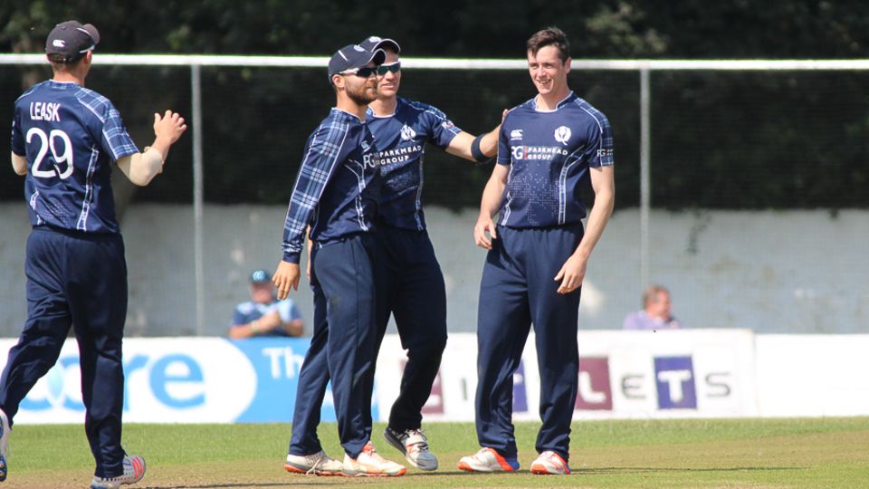 Chris Sole gets congratulated after his third wicket on debut