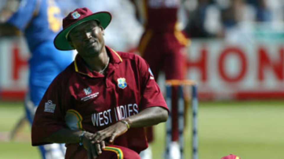 Carl Hooper and wicket-keeper Ridley Jacobs react after missing a ball going between them off the bat of Sanath Jayasuriya