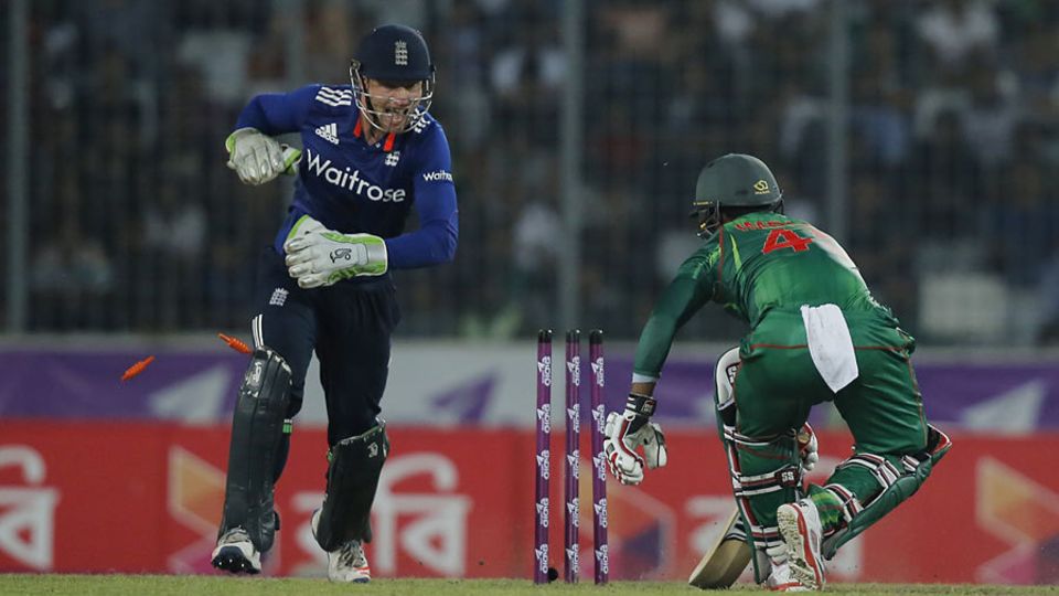 Jos Buttler completes the stumping of Imrul Kayes