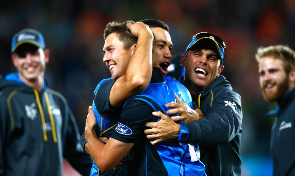 Chris Donaldson (in cap with sunglasses) joins a hug with Ross Taylor and Trent Boult after New Zealand's World Cup semi-final win in Auckland in 2015