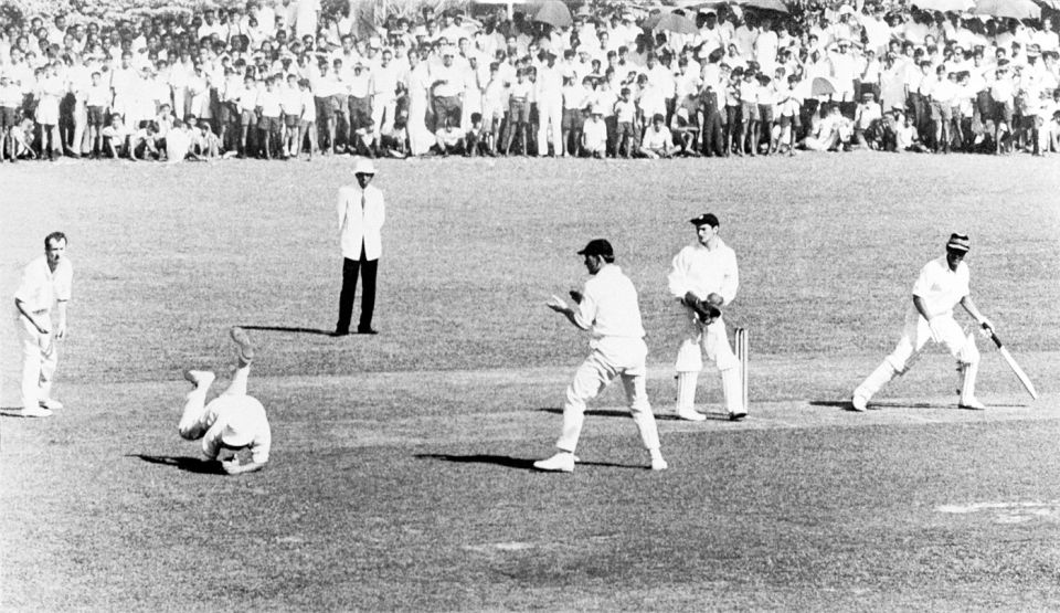 MC Cowdrey, playing for MCC, is watched by wicketkeeper APE Knott as he takes a catch at slip to dismiss Central Province's T Morrell off the bowling of DL Underwood in Kandy, 1969