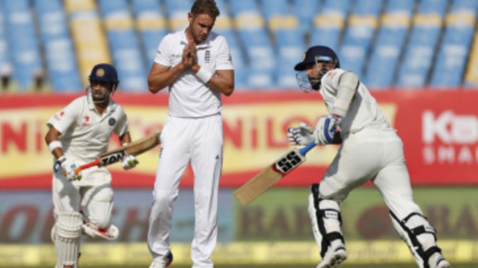 Stuart Broad is deep in thought while India's openers scamper for runs