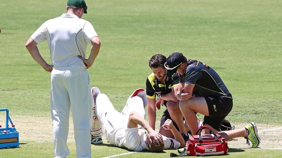 Adam Voges was helped from the field after being struck by a bouncer