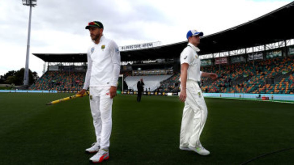 Faf du Plessis and Steven Smith walk away