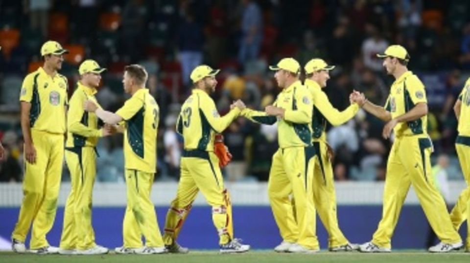 Australian players celebrate after winning the match and clinching the Chappell-Hadlee series