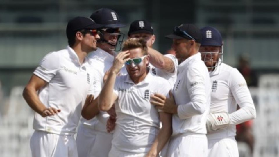 Liam Dawson enjoys his first wicket with his team-mates