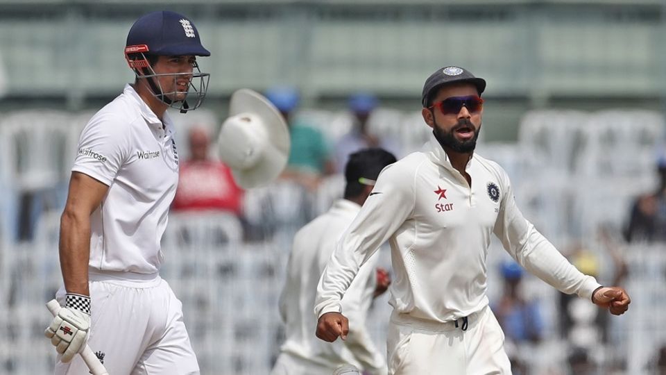 Virat Kohli celebrates as Alastair Cook is caught at leg slip