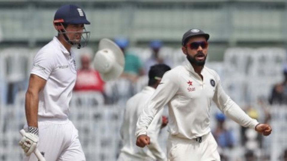 Virat Kohli celebrates as Alastair Cook is caught at leg slip