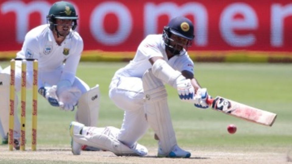 Dimuth Karunaratne plays a sweep