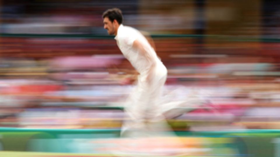 Mitchell Starc runs in to bowl