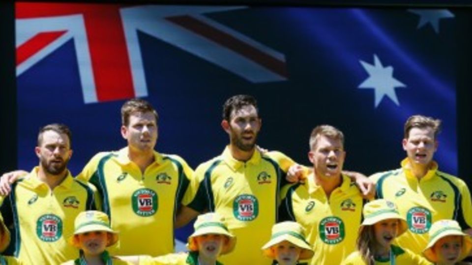 The Australian players in full voice during the national anthem