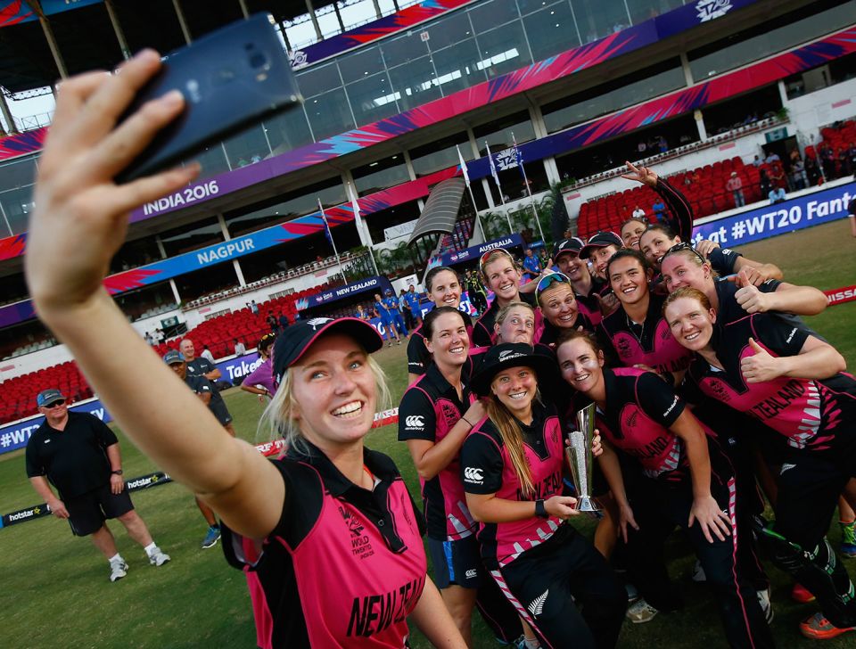 Leigh Kasperek (holding the trophy) poses for a selfie with her team-mates after New Zealand's win over Australia in Nagpur