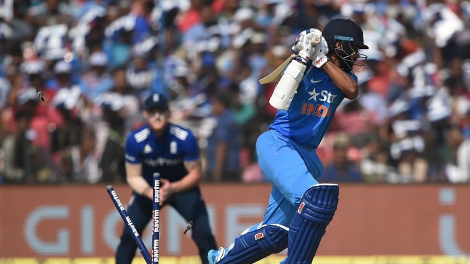 Shikhar Dhawan played on to Chris Woakes as England applied more early pressure with the ball
