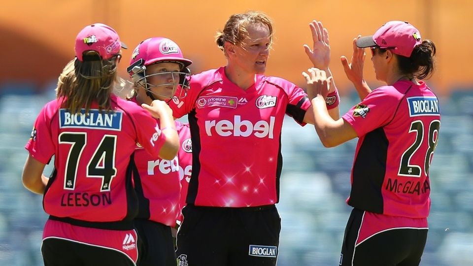 Sarah Aley (centre) recently finished with 4 for 23 to help Sydney Sixers successfully defend 124 in the Women's BBL final