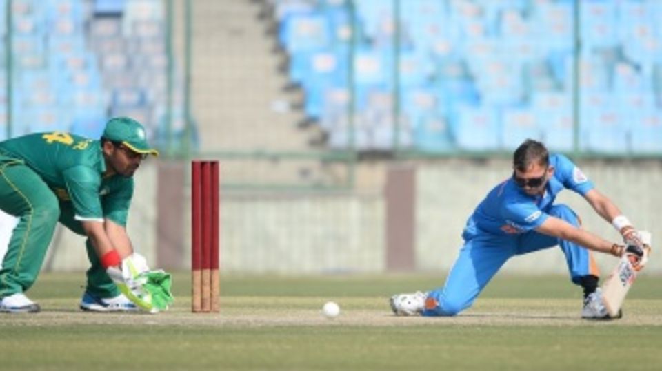 Ketanbhai Patel plays a shot against Pakistan