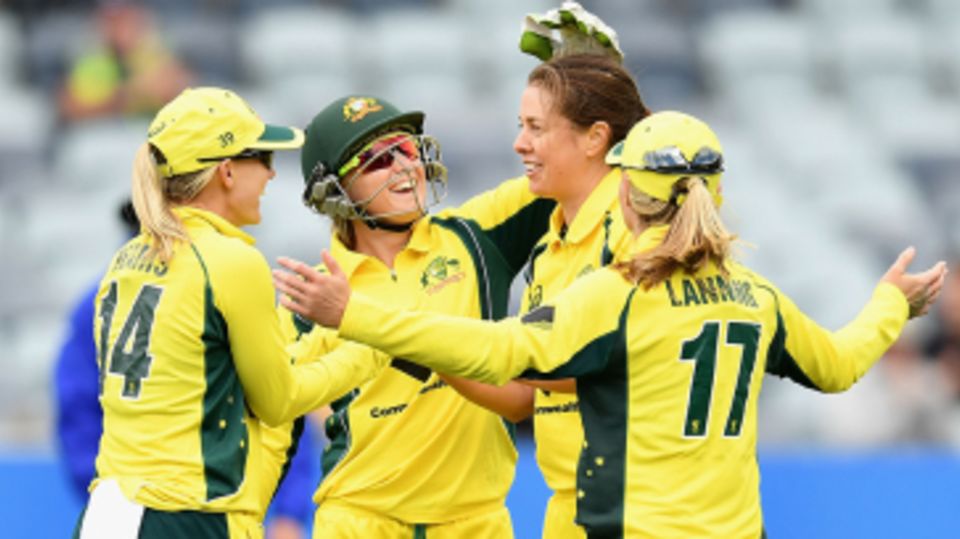 Molly Strano celebrates a wicket with her team-mates
