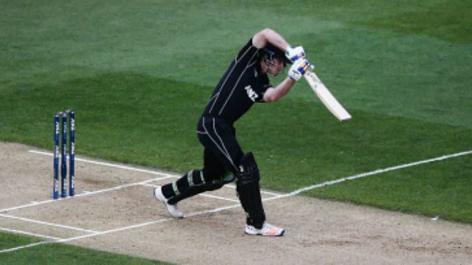 James Neesham drives down the ground