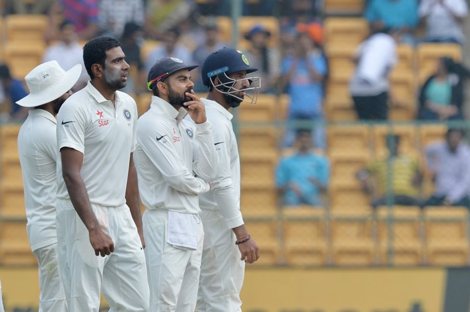 Waiting on DRS: R Ashwin, Virat Kohli and Cheteshwar Pujara stare at the big screen in hope