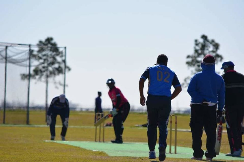 Nilesh Patil of the Houston Indian Cricket Club faces up to Houston Stallions bowler Ali Hussain