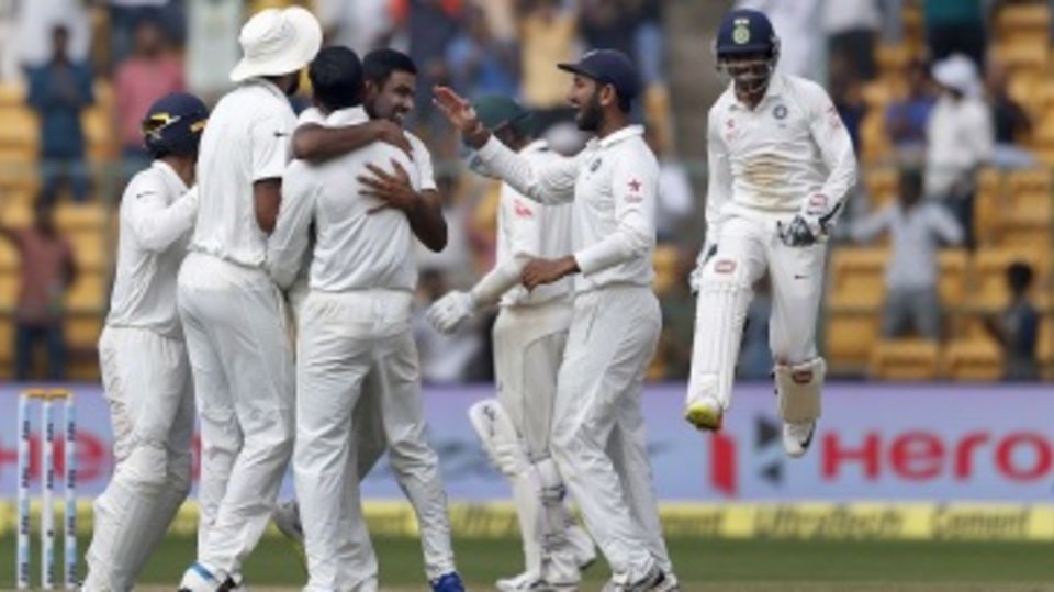 R Ashwin celebrates with team-mates after closing out the Test